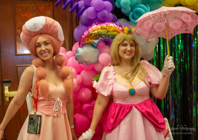 Guests in costume cosplay as Princess Peach and Toadette